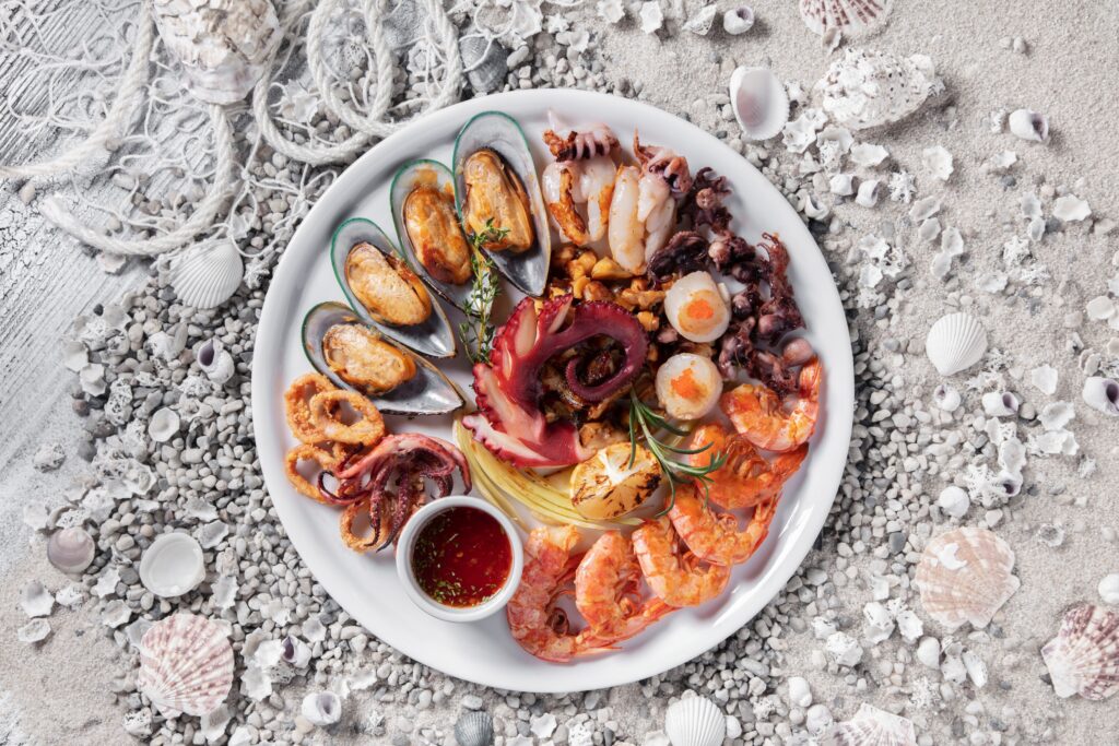 Mussels in shells on a platter.
